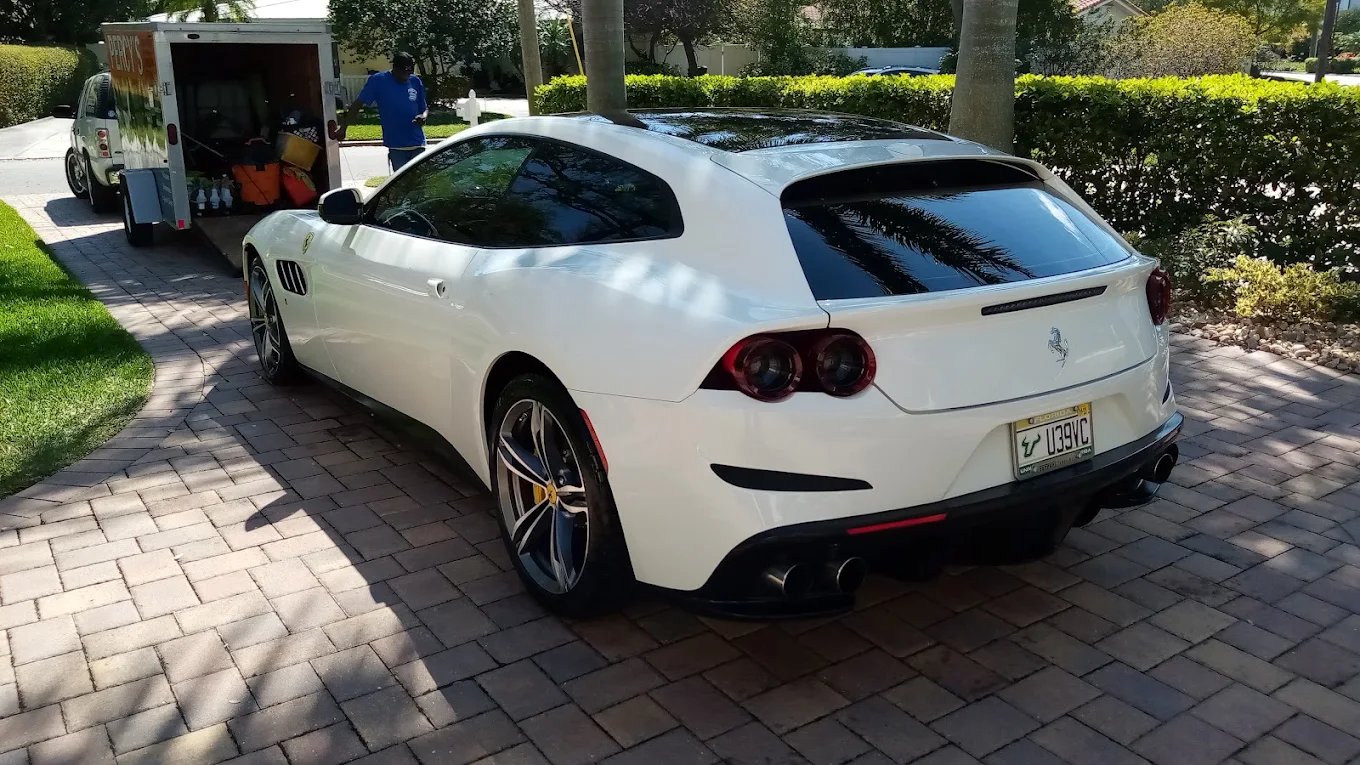 Percy's mobile trailer servicing a Ferrari GTC4Lusso in a customer's driveway