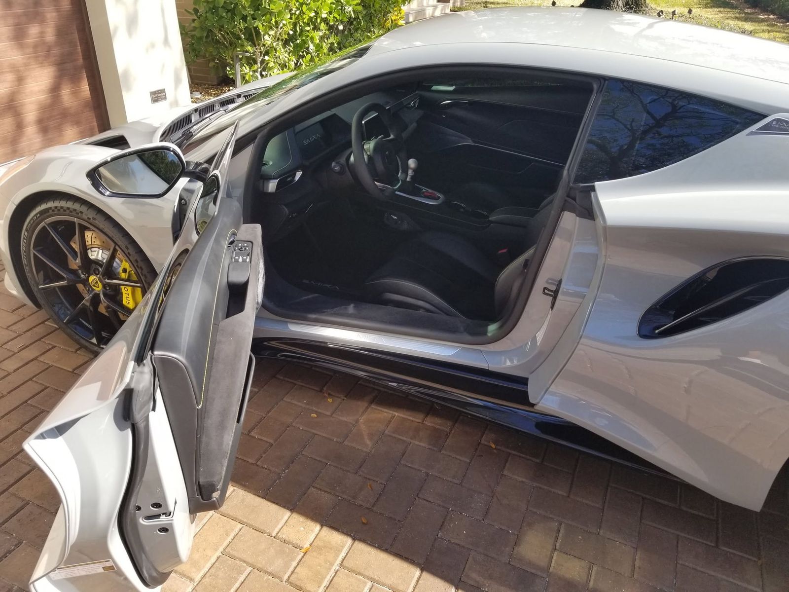 Lotus Emira with fresh window tint, door open
